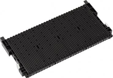 The image shows a black, rectangular component with a textured surface. It has two small protrusions on each of the longer sides. It appears sturdy and is flat.