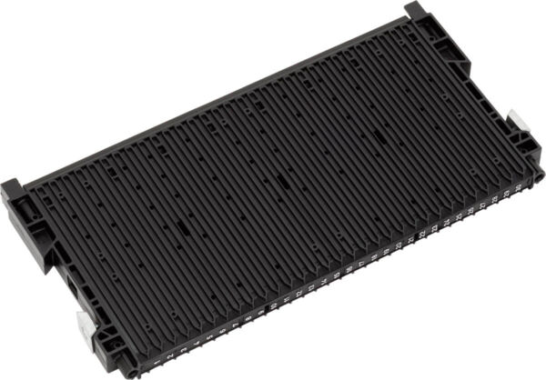 The image shows a black, rectangular component with many parallel grooves. It has small brackets at the ends and looks like a technical module or a circuit board.