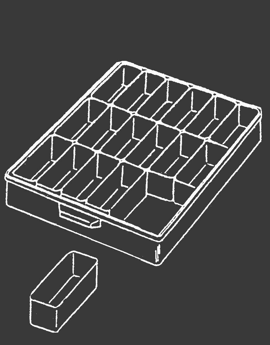 The image shows a rectangular storage container with many small compartments. Next to the container lies a single compartment that has been removed. The background is dark.