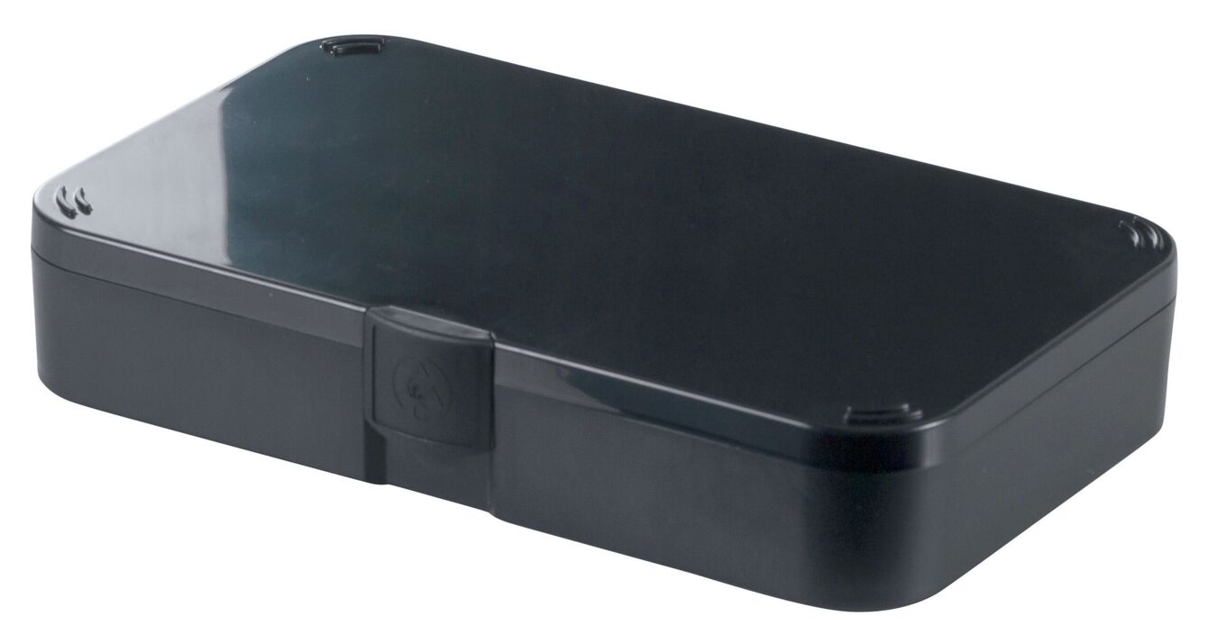 It is a rectangular, flat box in black with a smooth, glossy lid. The box has a flap in the middle for opening and is designed to be sturdy and inconspicuous.