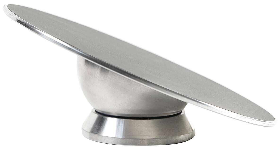 The image displays a round, flat stainless steel plate angled on a spherical base. The surface is smooth and reflective.