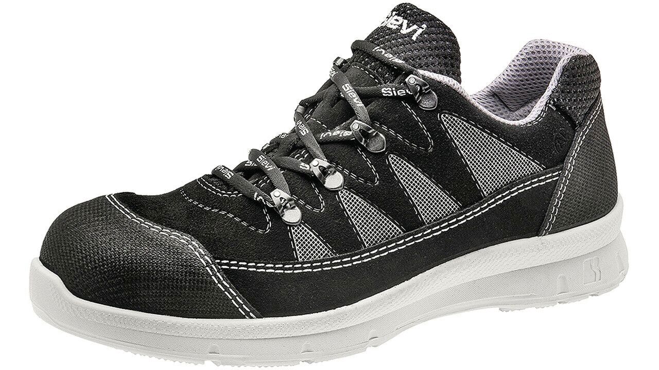 The shoe is a lightweight, black athletic shoe with gray and white accents. It has a grippy sole and laces that provide a snug fit. The upper is comfortably padded.