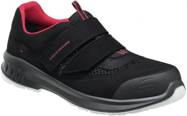 The shoe is a black athletic shoe with pink accents. It has a padded collar and two Velcro straps. The sole is lightweight and has a non-slip texture.