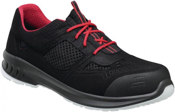 The shoe is black with red accents. It has a clear, sporty shape, a breathable mesh upper, and a sturdy, non-slip sole.