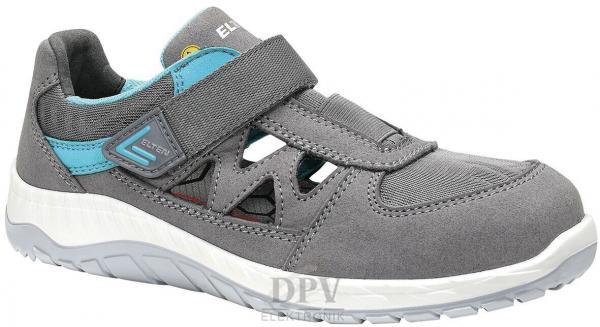 The shoe is gray with blue accents. It has a breathable upper, a wide sole, and a Velcro strap. The front is slightly raised and the sole has a grippy pattern.