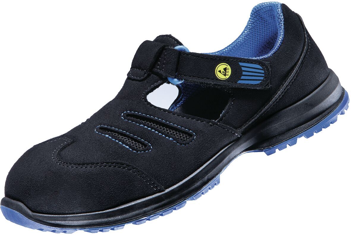 The shoe is black with blue accents. It has a closed design, an adjustable strap, and several openings for ventilation. The sole is non-slip and sturdy.