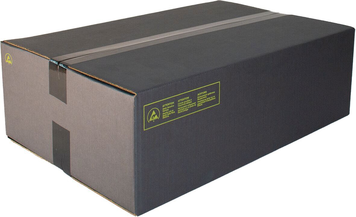 The image shows a rectangular, black cardboard box with a matte finish. It has two wide adhesive tapes on top and a yellow sticker label on the side.