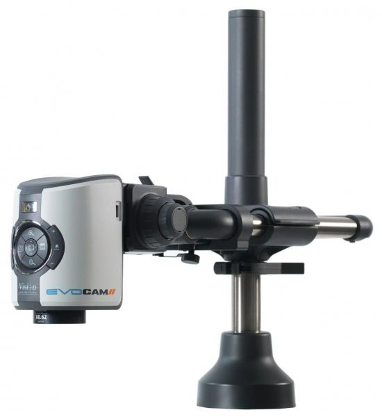 The image displays a compact camera device on a stable stand. It has a silver surface with controls and an elongated, black mount. The design is functional and modern.