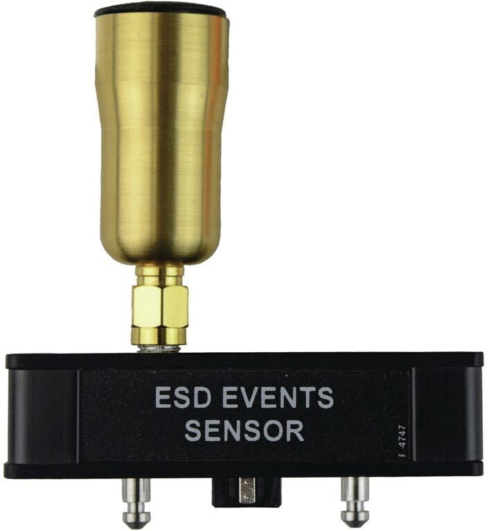 The image shows an ESD event sensor. It has a black body with the label "ESD EVENTS SENSOR" and a golden, domed cap on top. Two connectors are visible on the lower part.