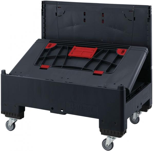 The image shows a black, rolling plastic box. The lid is open, and red and black holders are visible on the inside. The box has sturdy wheels for easy movement.