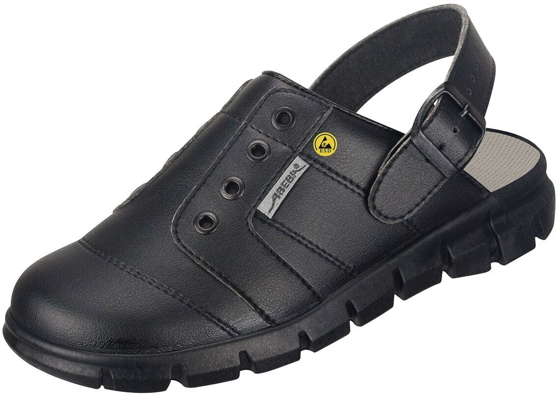 The shoe is a black leather clog with an open heel area and a padded interior. It has a sturdy, non-slip sole and is equipped with small ventilation holes.