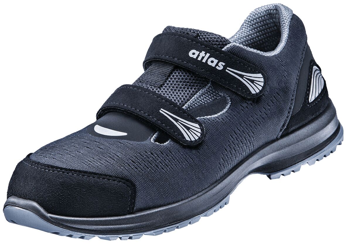 The shoe is black with a lined upper and two Velcro fastenings. It has a sporty, comfortable shape and a sturdy, non-slip sole. Ideal for active use.