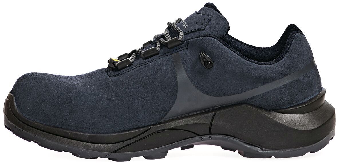 The shoe is dark blue, made from soft material, features a comfortable, cushioned sole, and a lace-free system with a small holder. The shape is sporty and modern.