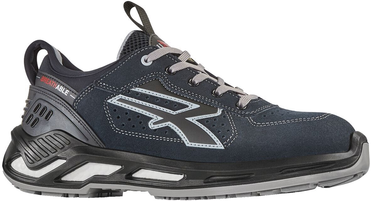 The shoe is a sporty sneaker in dark blue with light accents. It has a sturdy, grippy sole and laces that provide a secure fit. The shape is modern and casual.