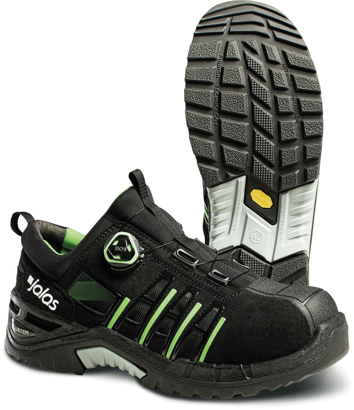 The image shows a black safety shoe with green accents. It features a sturdy sole with deep tread and a lacing system that can be adjusted with a twist lock.