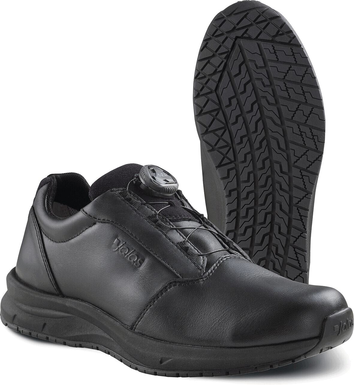 The image shows a black shoe with a smooth leather surface and a non-slip sole. It features a quick closure system with a button on the top.