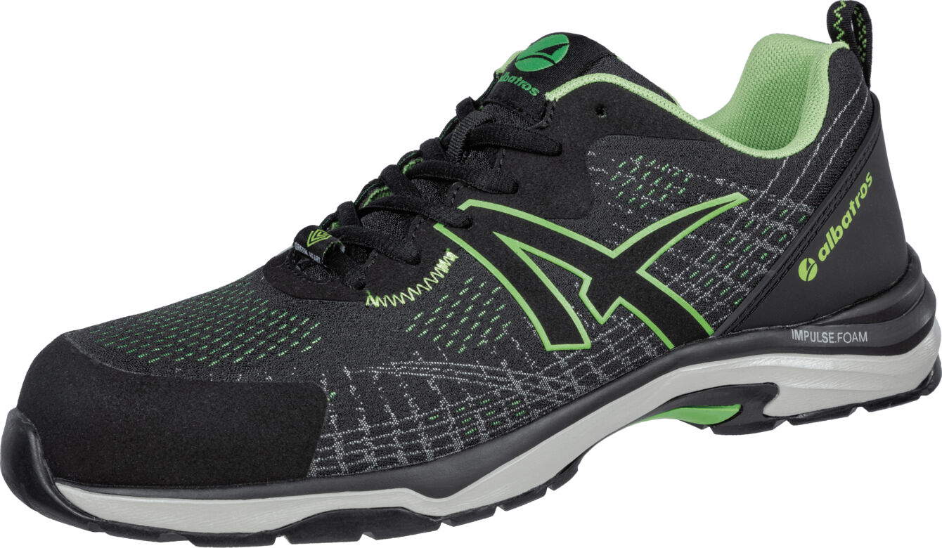 The shoe is sporty with a black upper and green accents. It features a breathable surface, a cushioned sole, and a modern, dynamic shape.