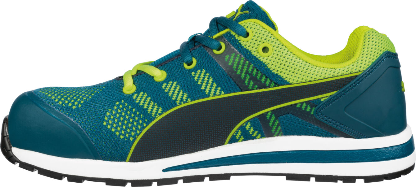 The shoe is sporty, has a deep blue color and bright green accents. It is made of breathable material with a white sole and provides lateral stability.