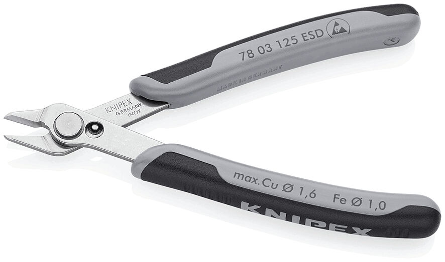 The image shows a pair of pliers with metallic, shiny cutting surfaces and gray, non-slip plastic handles. It is used for cutting wire or similar material.