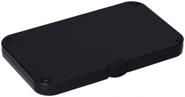 The image shows a flat, rectangular black box. It has rounded corners and a small locking mechanism on one side. The surface is smooth and uniform.