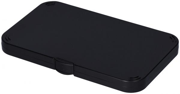 The image shows a rectangular, flat, black case. It has rounded corners and a small opening in the middle, which presumably serves for opening or closing.