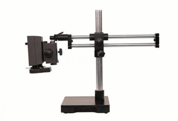 The image shows an optical table with a stable base. Attached to the vertical column are two rails, on which an arm with a camera or lens is mounted.