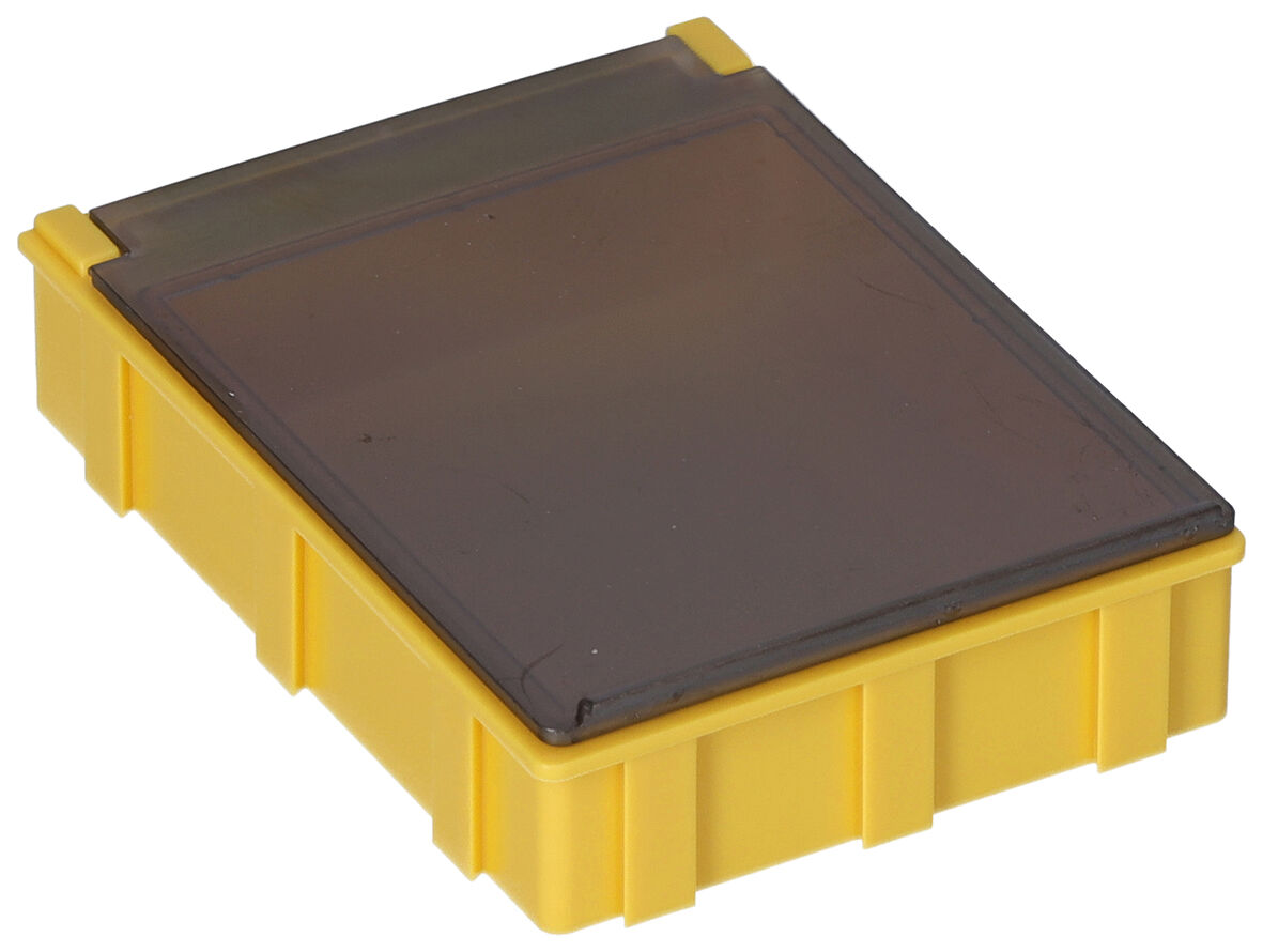 The image displays a rectangular container in bright yellow with a transparent, gray lid. The container has a textured surface and a flat shape.