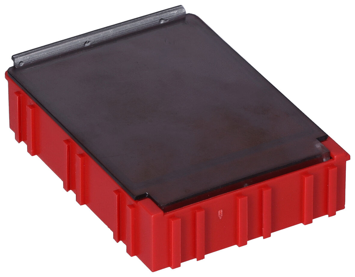 The image displays a rectangular box in bold red with a flat, black lid. The box has a textured surface with slightly protruding edges.