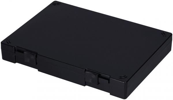 In the image, there is a black, rectangular casing visible. It has rounded corners and two small flaps on the front. The surface is smooth and unmarked.