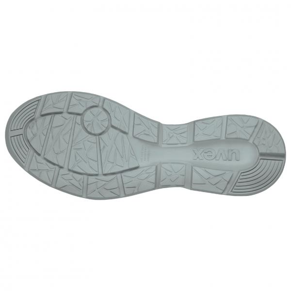 The image shows the underside of a shoe. The sole is light gray and features a textured pattern with various grooves and ridges that provide better grip.