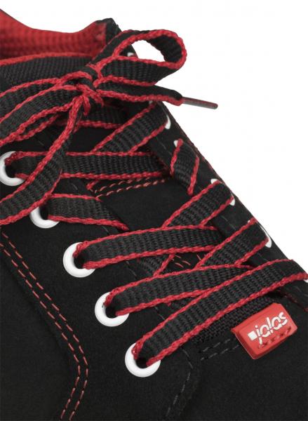 The image shows a black shoe with red shoelaces. The eyelets are white and the shoe features a red brand label. The stitching is also red, providing an attractive contrast.