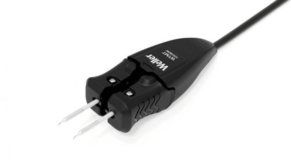 The image shows a black electric plug with two metal pins. The plug has a serrated surface for better grip and a cable that extends from it.