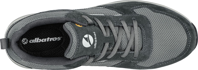 The shoe is gray and features a combination of mesh and suede materials. It has a flat sole and laces. The lining is black and the brand is visible.