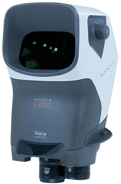 The image shows an optical device with a rectangular casing that is rounded on top. It has a large opening at the front through which one can look, and two round eyepieces at the bottom. The color scheme is gray and white.