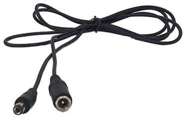 The image shows a black cable with two plugs at the ends. The plugs are round and have a metal surface. The cable is slightly wavy and lies on a flat surface.