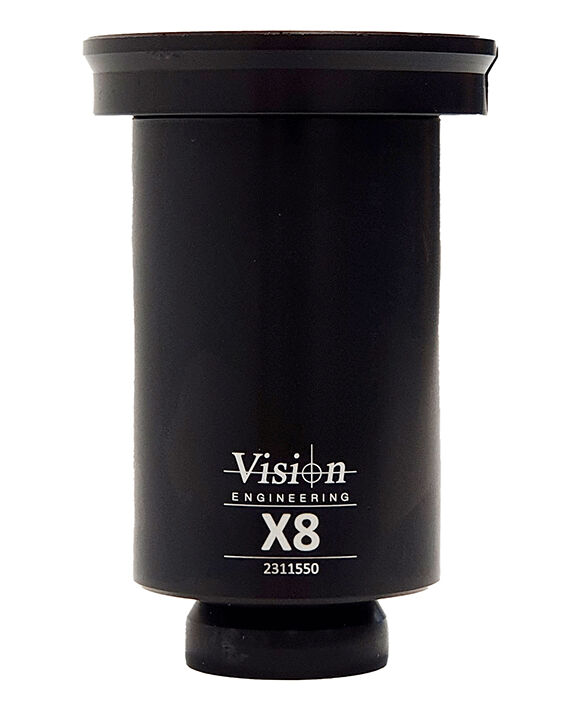 The image shows a black, cylindrical device with a wider upper rim and a narrow bottom. It is labeled "Vision Engineering X8" and appears technical and functional.