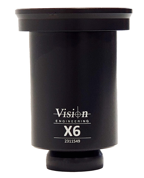 The image displays a black-painted cylindrical object with a wide upper rim. It is marked with the inscription "Vision Engineering X6" and has a round base.