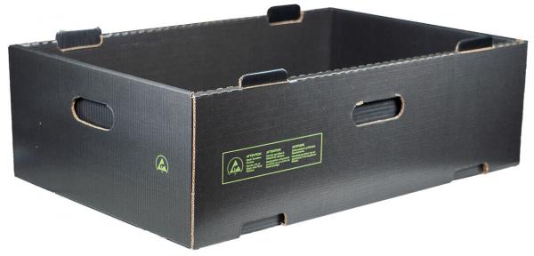 The image shows a rectangular, black cardboard box with an open top. It has side grip holes and a smooth surface, with a small, green inscription on one side.