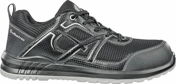 The shoe is a black, sporty sneaker. It has a breathable surface, laces, and a cushioned sole for comfort. The sides are adorned with a subtle pattern.