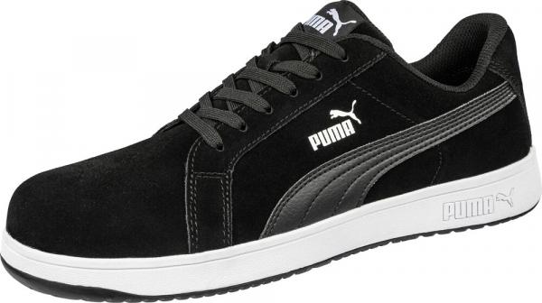 The shoe is a black sneaker made from soft material with a white, non-slip sole. It has round laces and a subtle Puma logo on the side.