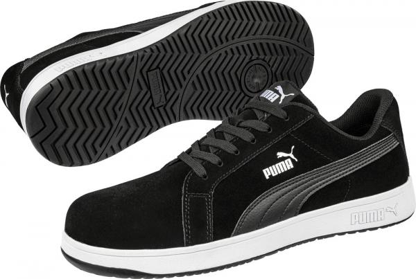 The image shows a pair of black athletic shoes with a white sole. The shoes feature lacing and side logos. They appear modern and sporty. The texture is soft with a clear profile.