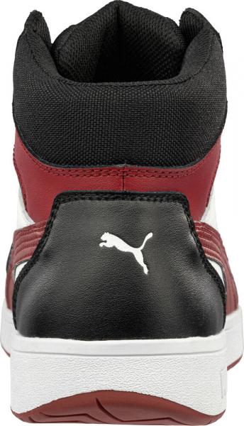 The image shows the rear view of a sporty sneaker. The shoe features a black, red, and white color scheme. The Puma logo is visible in white on the heel, and the collar is high.