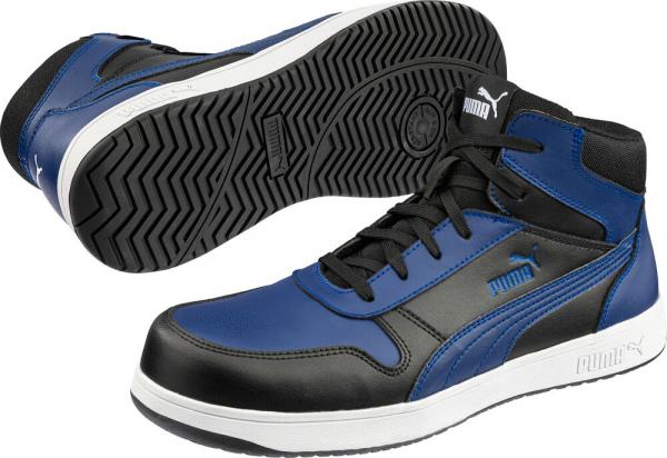 The image shows a pair of athletic shoes by Puma. They are black and blue with high lacing. The sole has a non-slip, textured pattern.