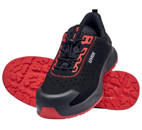 A black shoe with red accents. The laces are red, the sole has a distinctive non-slip design in red. The shoe has a sporty shape.