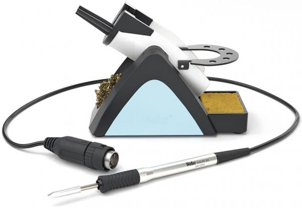 The image displays a soldering station with a silver soldering iron, a stand, and a yellow sponge. A cable connects the soldering iron to the station.