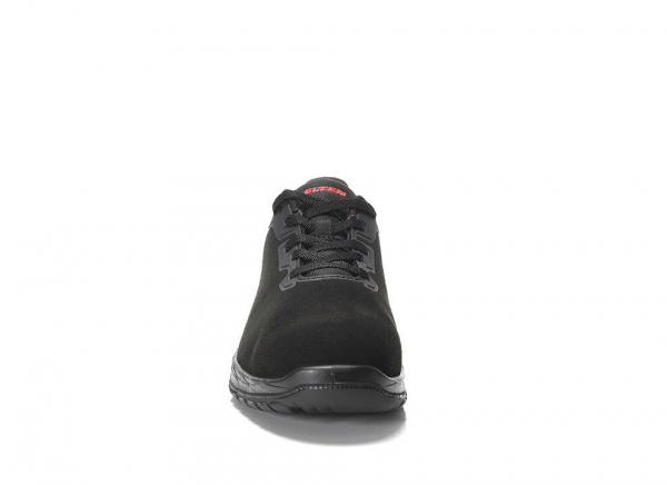 The image shows a black suede shoe with a round toe and lacing. It has a padded sole for comfort and looks sporty.