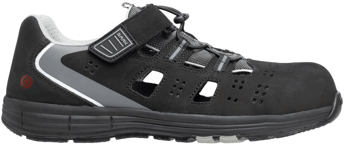 The shoe is black with gray accents. It has a breathable upper with multiple ventilation holes and a stable, non-slip sole. Lacing and Velcro closure for optimal support.