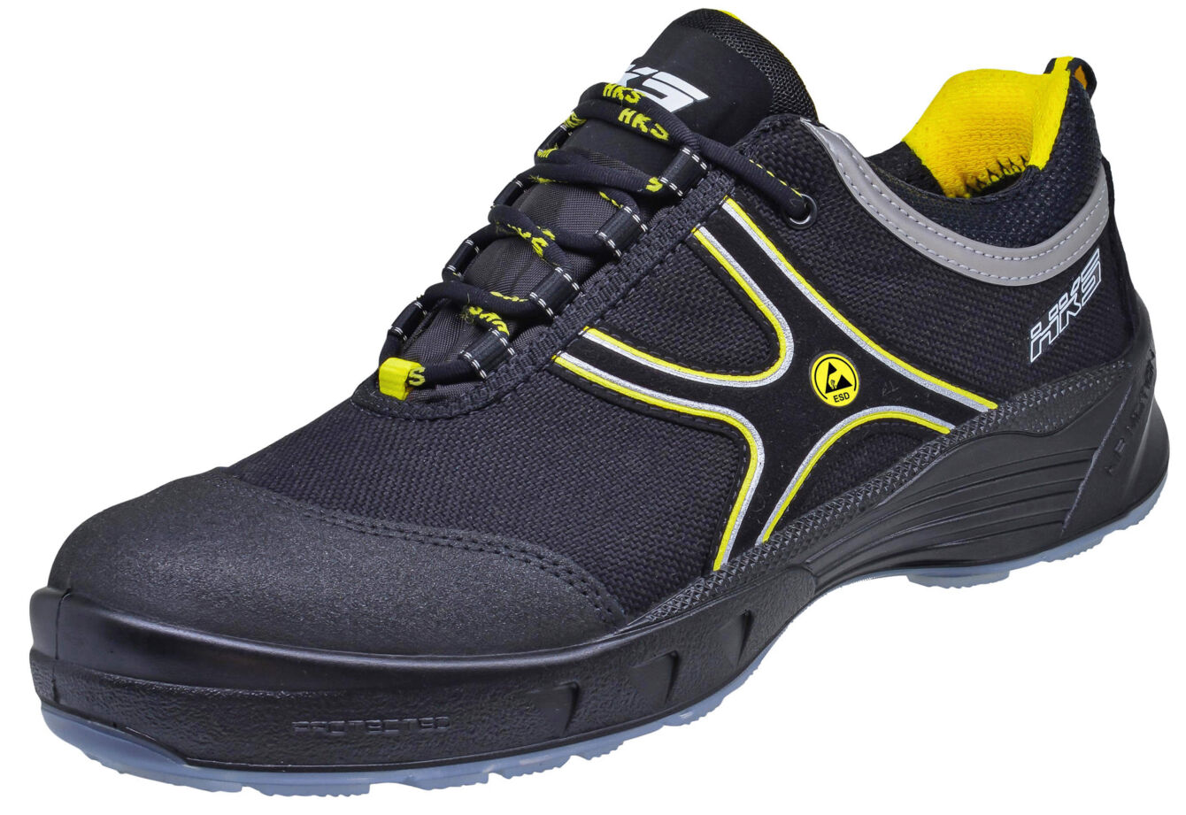 The shoe is a sporty sneaker in black with yellow and gray accents. It features a lightweight, functional design and a sturdy rubber sole for good grip.