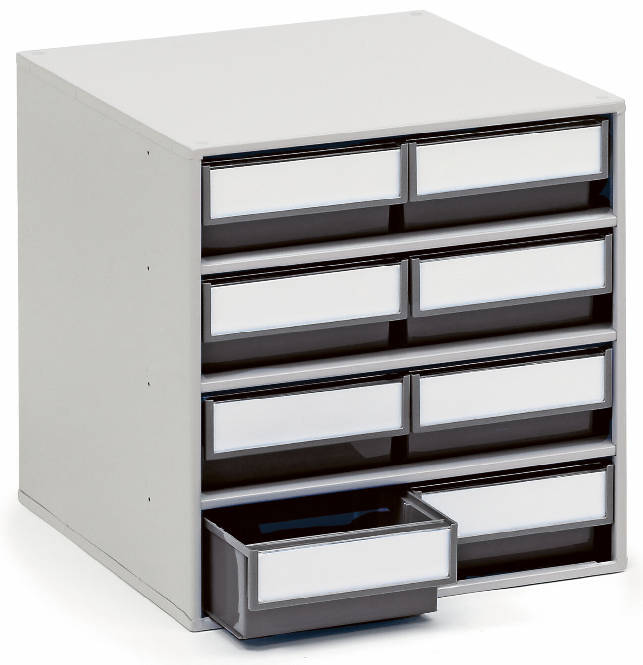 The image shows a simple, square dresser with nine drawers in two rows. The drawers have white fronts and a gray frame. One drawer is pulled out.