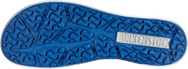 The image shows the underside of a blue shoe. The sole has a textured pattern with waves and grooves that provide better grip. A silver logo is visible.